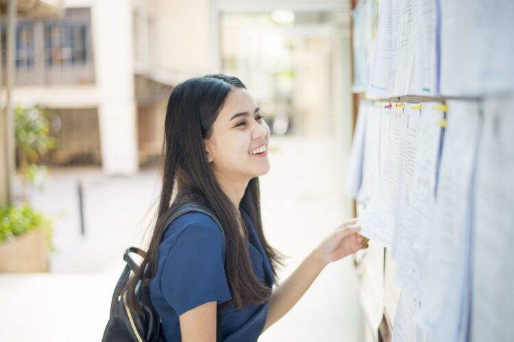 A female university student is exciting with the exam report